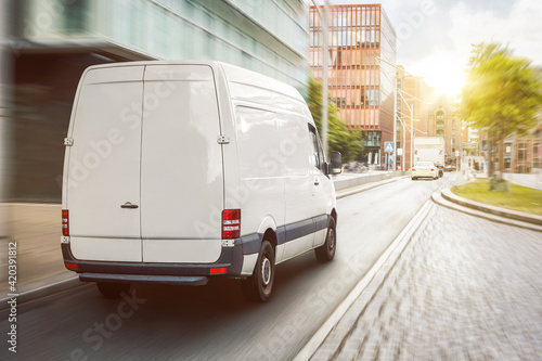 Cargo van driving in the city photo