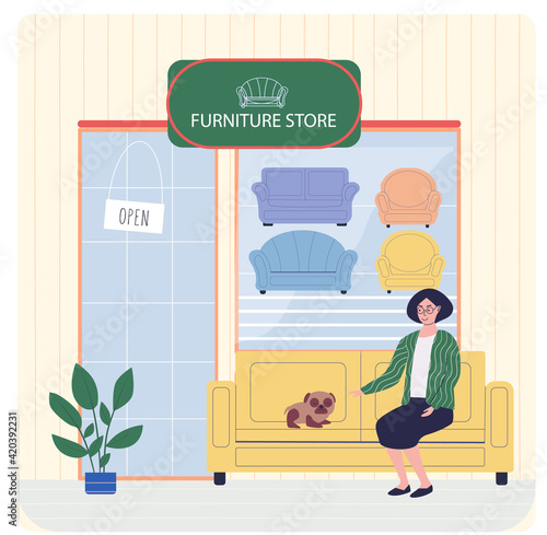 Furniture store, female buyer consults with seller regarding purchase of couch during sale