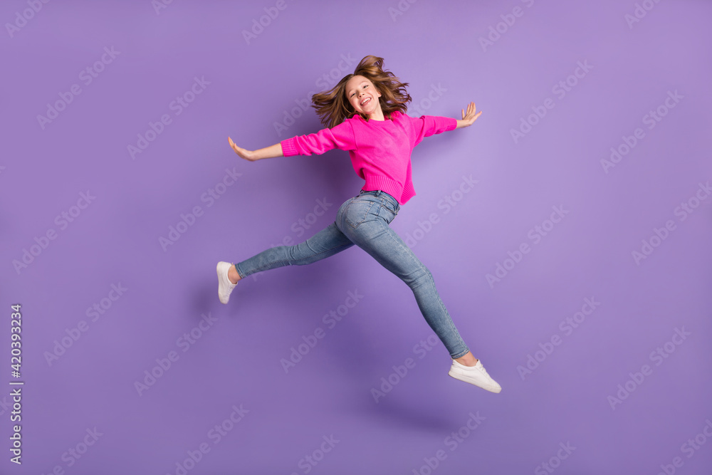 Full body profile side photo of cheerful energetic girl jump up empty space good mood isolated on purple color background