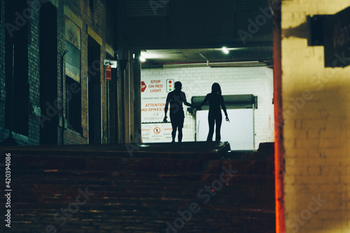 silhouette of a person in a subway station