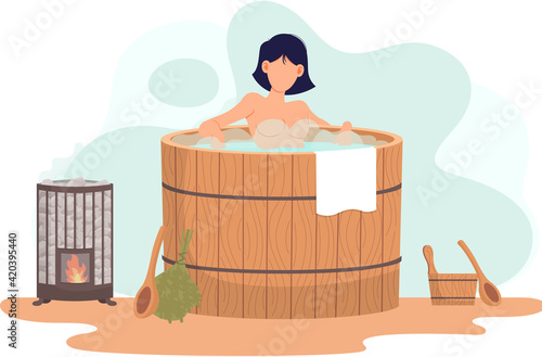 Woman sitting in wooden font. Person is bathing in barrel with water heated with fire device