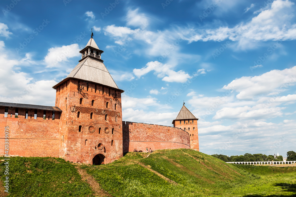 View of the fortress wall of the Novgorod Kremlin with the Spasskaya and Dvortsovaya towers. Veliky Novgorod, Russia