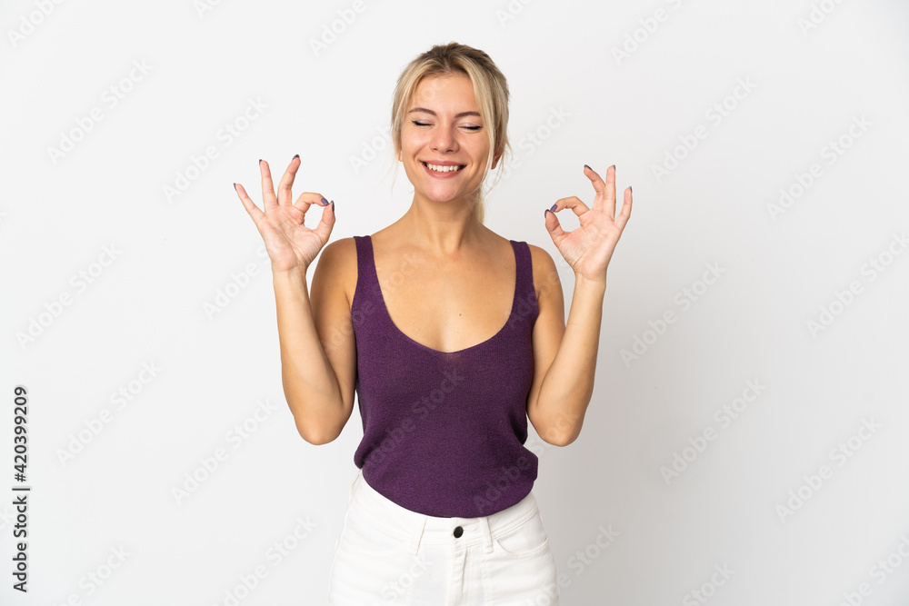 Young Russian woman isolated on white background in zen pose Young Russian woman isolated on white background in zen pose