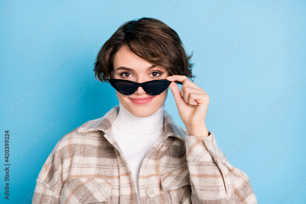 Photo of optimistic nice short hairdo lady touch spectacles wear white shirt isolated on vivid teal color background