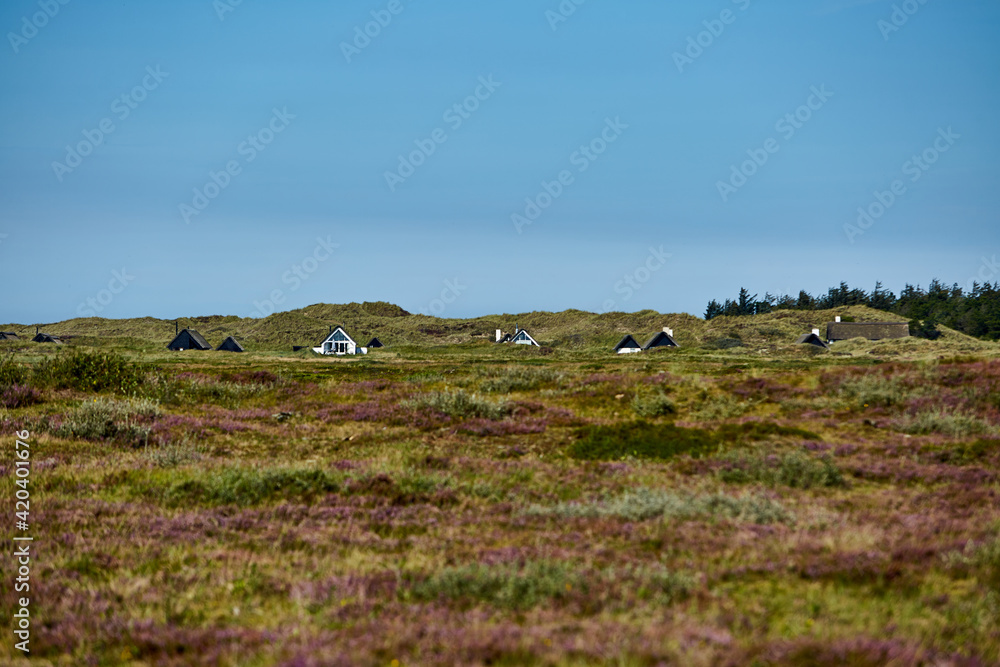 summer houses on the beach with blue sky
