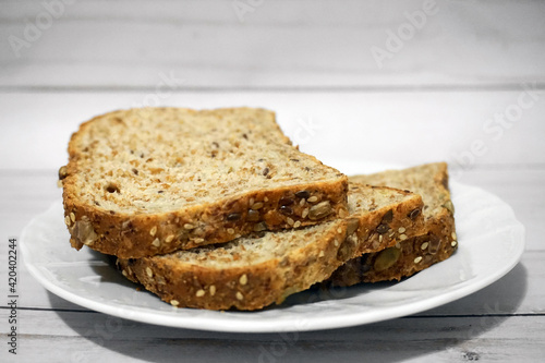 Sprouted Whole Grains Sliced Bread close up. Healthy eating concept.