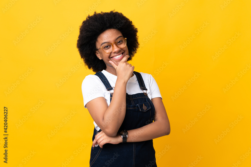 Young African American woman isolated on yellow background happy and smiling Young African American woman isolated on yellow background happy and smiling