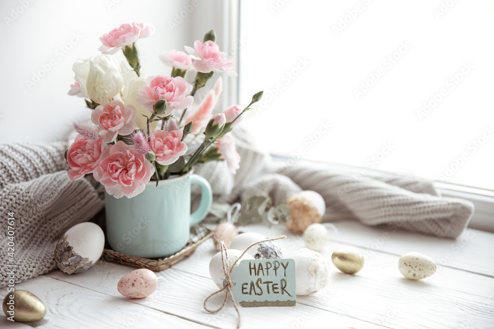 Easter composition with fresh flowers in a vase and the inscription Happy Easter on the card copy space. Easter composition with fresh flowers in a vase and the inscription Happy Easter on the card copy space.