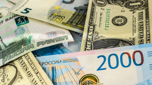 American dollars, EURO banknotes and Russian rubles. Currency exchange concept. Sanctions. Money background. Selective focus.