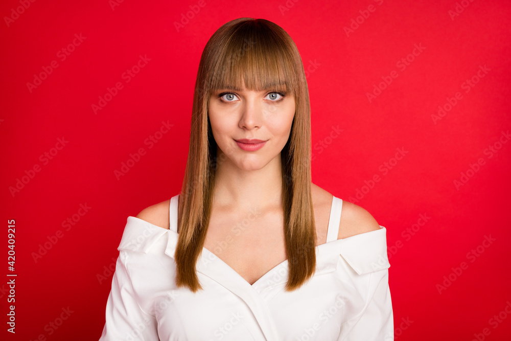 Photo of young attractive blond hair woman serious confident wear blouse isolated over red color background Photo of young attractive blond hair woman serious confident wear blouse isolated over red color background