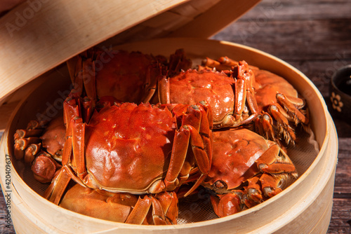 steamed chinese mitten crab, shanghai hairy crab in bamboo steamer photo