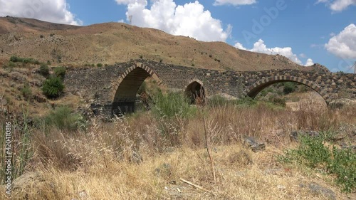 Medieval bridge of Adrano, Sicily, of arabic origin and saracen. Called Simeto river  lava gorges. Video 4k photo