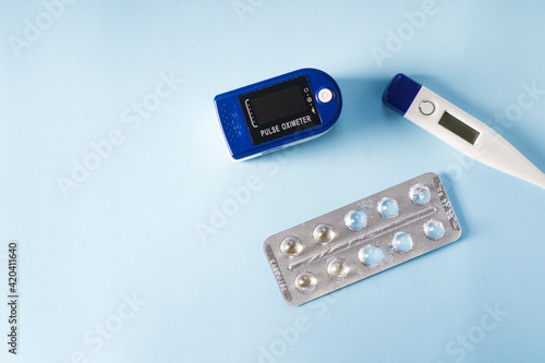 Health care thermometer heart rate monitor and pill packaging.