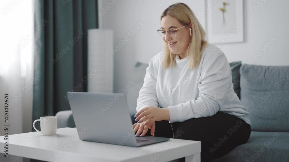 Overweight woman having video call Overweight woman having video call