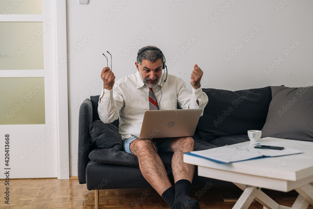 man work from home. he has online meeting