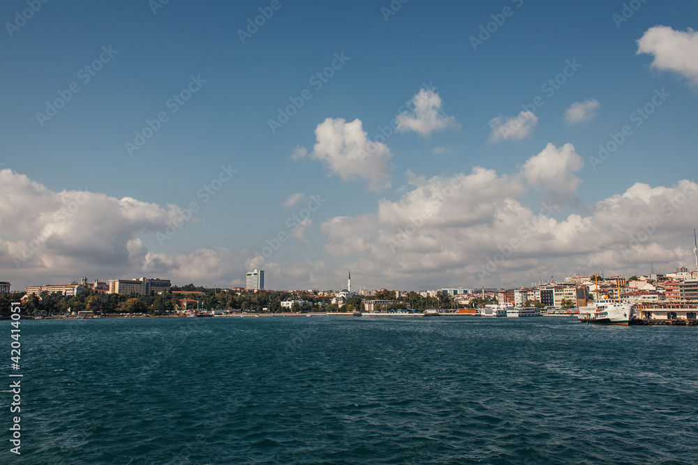 Sea and buildings on coast of Istanbul with sky at background, Turkey