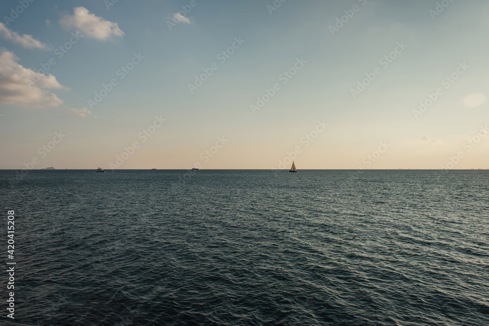 Landscape with ship in sea and skyline