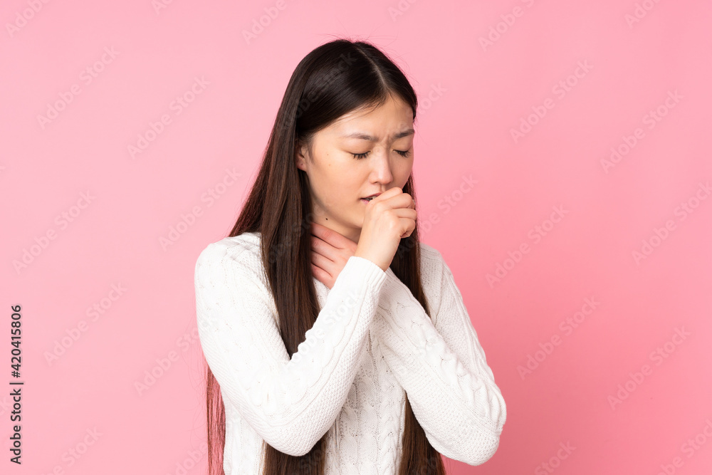 Young asian woman over isolated background coughing a lot Young asian woman over isolated background coughing a lot