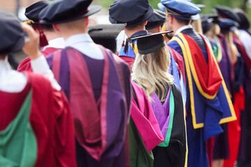 University graduates at graduation  ceremony, education concept