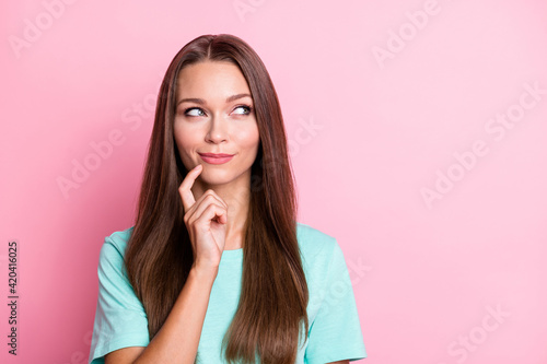 Portrait of young beautiful happy smiling dreamy woman hold finger on chin look copyspace isolated on pink color background