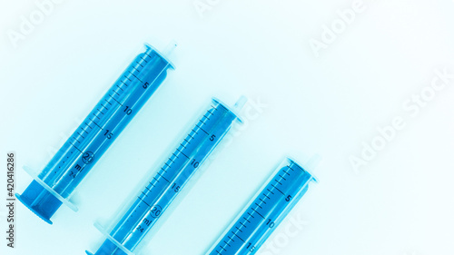Set with different syringes on white background.