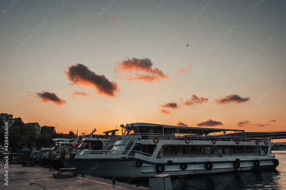 Moored vessels near embankment during sunset, Istanbul, Turkey Moored vessels near embankment during sunset, Istanbul, Turkey