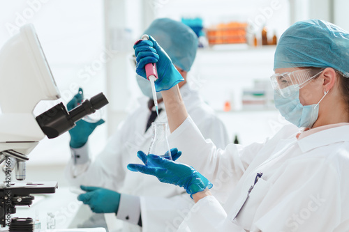 close up. laboratory staff is testing the new vaccine.