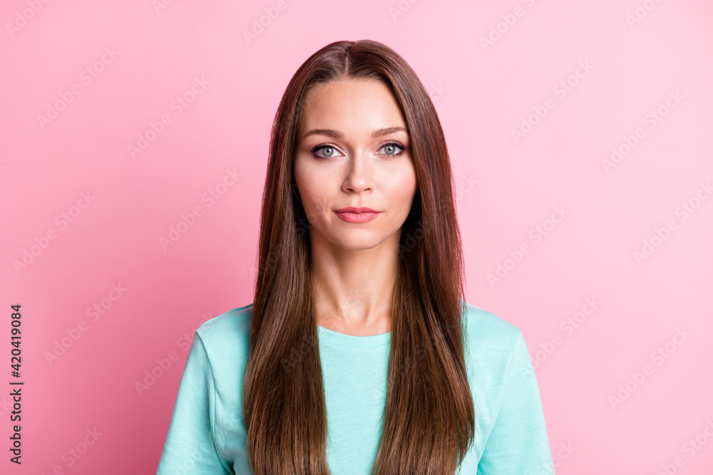Portrait of young attractive serious calm smart woman wear turquoise t-shirt look camera isolated on pink color background