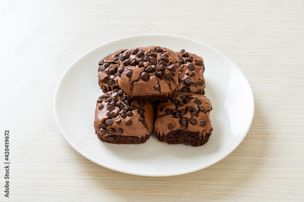dark chocolate brownies topped by chocolate chips dark chocolate brownies topped by chocolate chips