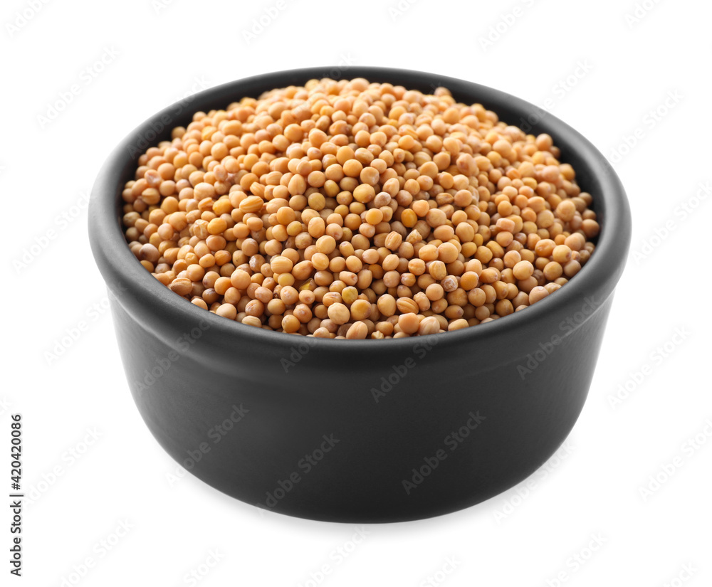 Mustard seeds in bowl isolated on white Mustard seeds in bowl isolated on white