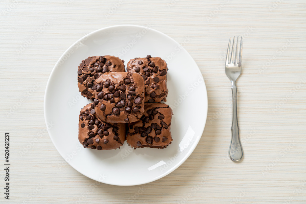 dark chocolate brownies topped by chocolate chips dark chocolate brownies topped by chocolate chips