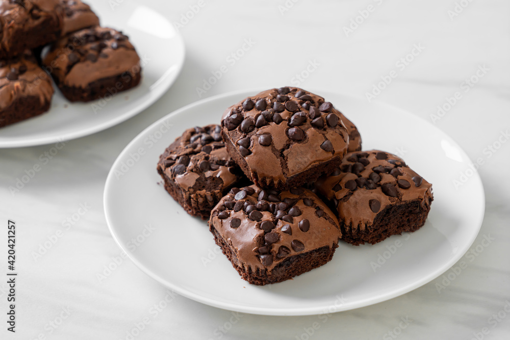 dark chocolate brownies topped by chocolate chips dark chocolate brownies topped by chocolate chips