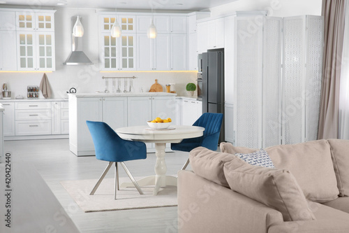 Stylish studio apartment interior with comfortable beige sofa © New Africa