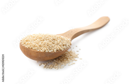 Wooden spoon with sesame seeds on white background