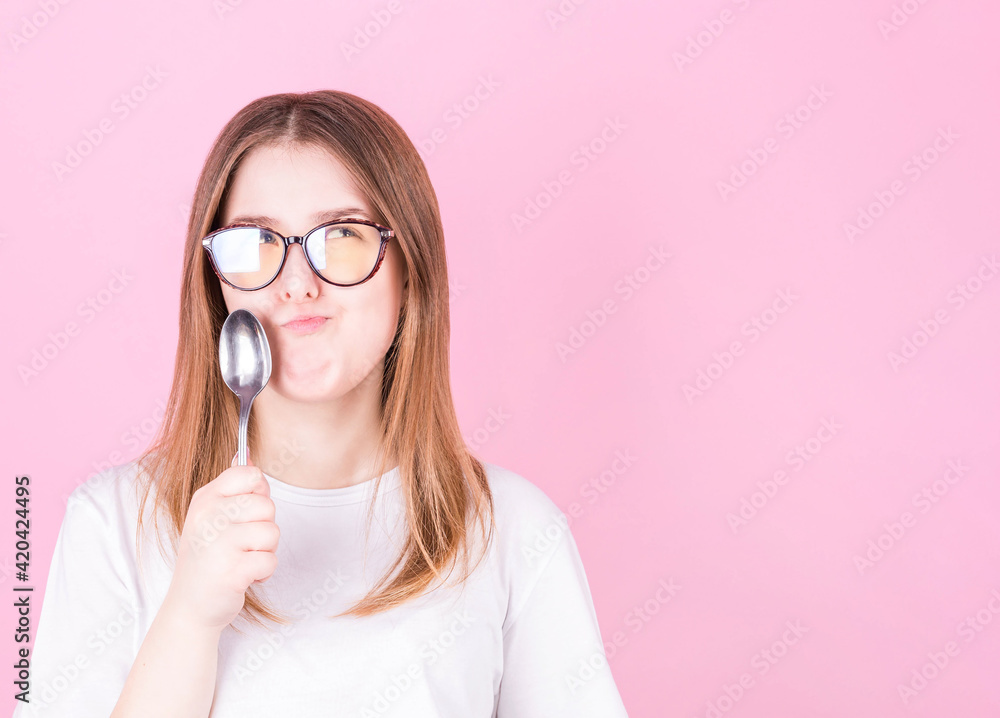 Photo of beautiful lady holding metal spoon in mouth look up empty space dreaming about tasty food wear dotted blouse shirt white isolated blue color background Photo of beautiful lady holding metal spoon in mouth look up empty space dreaming about tasty food wear dotted blouse shirt white isolated blue color background
