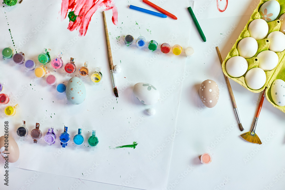 Top view pack of eggs with brush, paint and decorative elements Top view pack of eggs with brush, paint and decorative elements