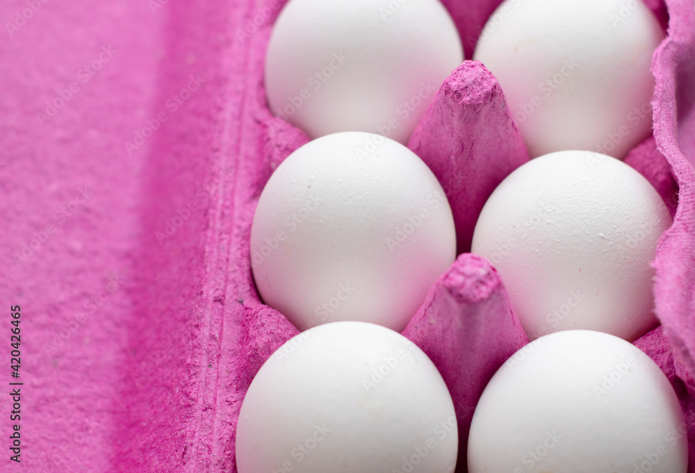 farm products, natural eggs, white, in bright pink packaging. Breakfast at home, cooking ingredients. Egg allergy. Protein morning. Easter farm products, natural eggs, white, in bright pink packaging. Breakfast at home, cooking ingredients. Egg allergy. Protein morning. Easter
