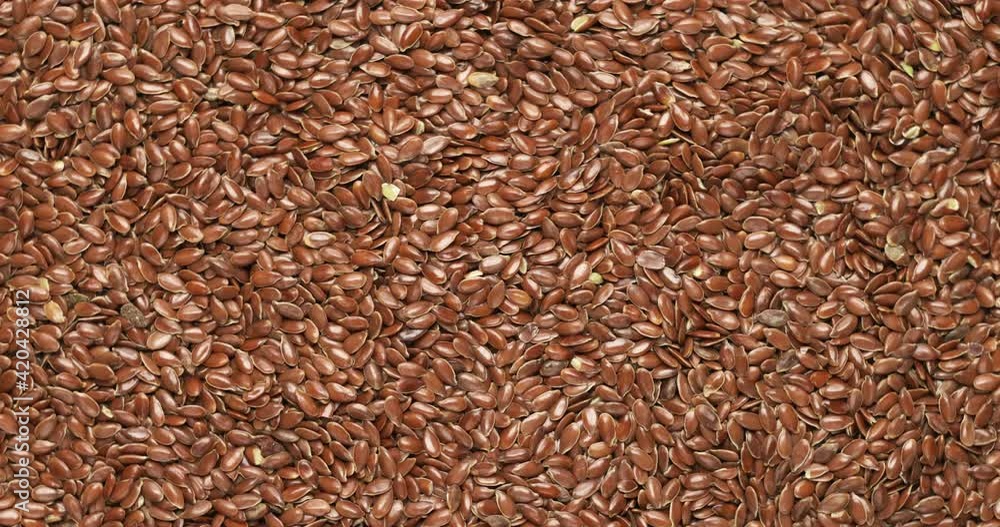 Closeup flax seeds rotation, background, texture. Slow motion 50fps, zoom effect. Food background. Closeup flax seeds rotation, background, texture. Slow motion 50fps, zoom effect. Food background.