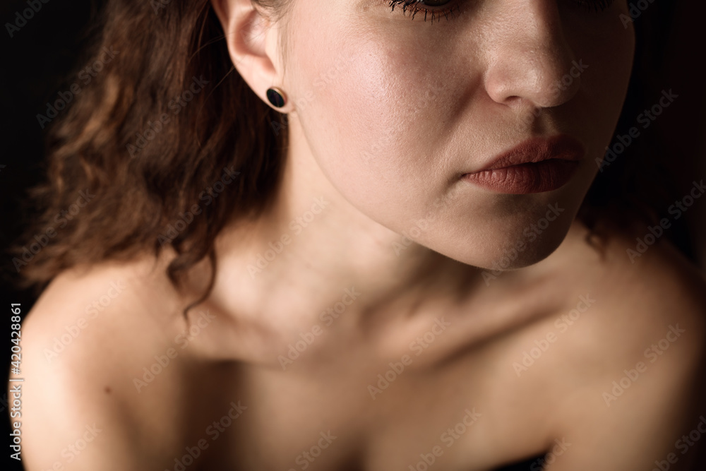 Girl's neck wtih dramatic light. Girl's neck wtih dramatic light.
