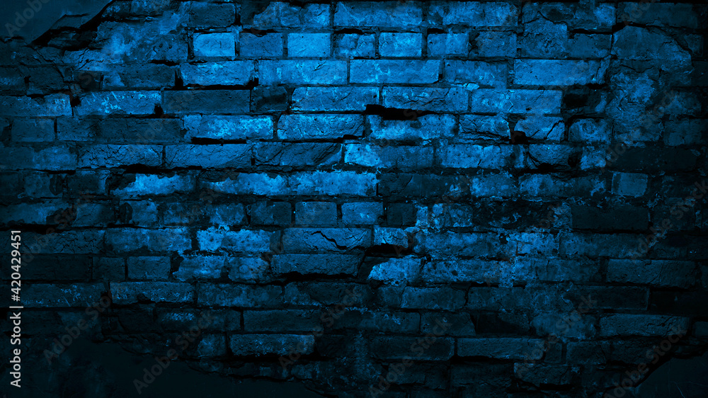 Dark blue old brick wall. Сlose-up. Collapsing brickwork. Grunge background with copy space for design. Distressed background. Halloween, horror. Dark blue old brick wall. Сlose-up. Collapsing brickwork. Grunge background with copy space for design. Distressed background. Halloween, horror.