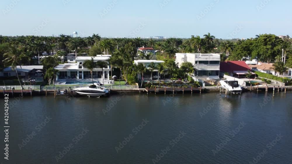 Hollywood Florida, Northlake 4K aerial drone view of waterfront luxury homes with swimming pools and yachts Hollywood Florida, Northlake 4K aerial drone view of waterfront luxury homes with swimming pools and yachts