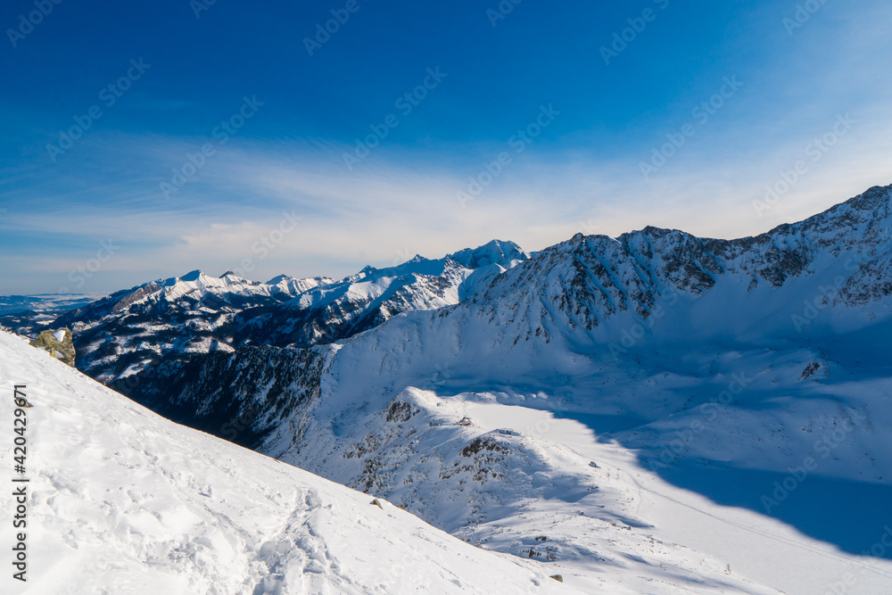 Winter snow covered mountain peaks in Tatras mountain. Great place for winter sports. Poland zakopane tatras