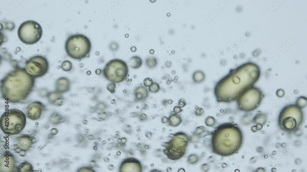 Amazing abstract drops of olive oil in the water. Wallpaper, resource.