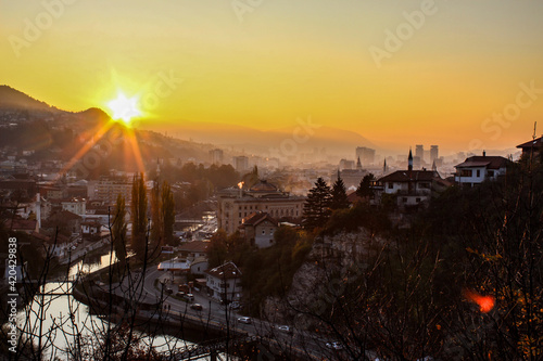 Beautiful sunset over Sarajevo and Sarajevo City Hall. Beautiful view of the city and the silhouettes of other sights of the city of Sarajevo.