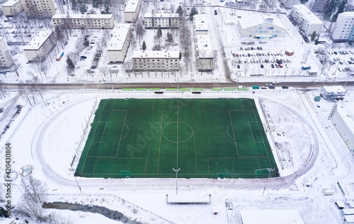 Obraz na płótnie Aerial view of the outdoor football heated field in winter, Finland. w salonie