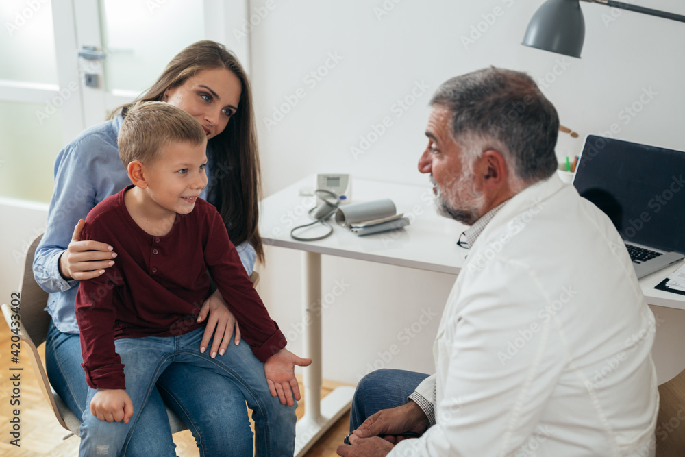 Fototapeta premium boy with his mother visit pediatrician
