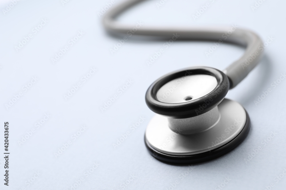 Stethoscope on white background, closeup. Space for text Stethoscope on white background, closeup. Space for text