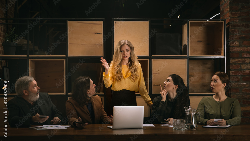 Panic attack. Young colleagues working together in a office styled like classical artworks. Look busy, attented, cheerful, successful. Medieval, renaissance mood. Concept of business, office, finance. Panic attack. Young colleagues working together in a office styled like classical artworks. Look busy, attented, cheerful, successful. Medieval, renaissance mood. Concept of business, office, finance.