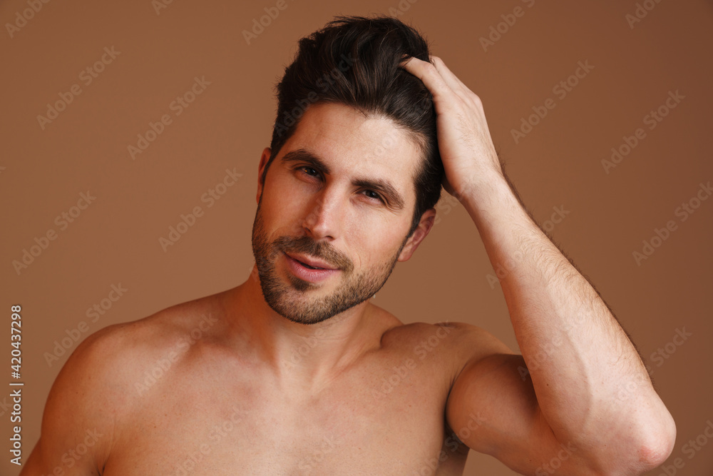 Shirtless masculine man posing and looking at camera Shirtless masculine man posing and looking at camera