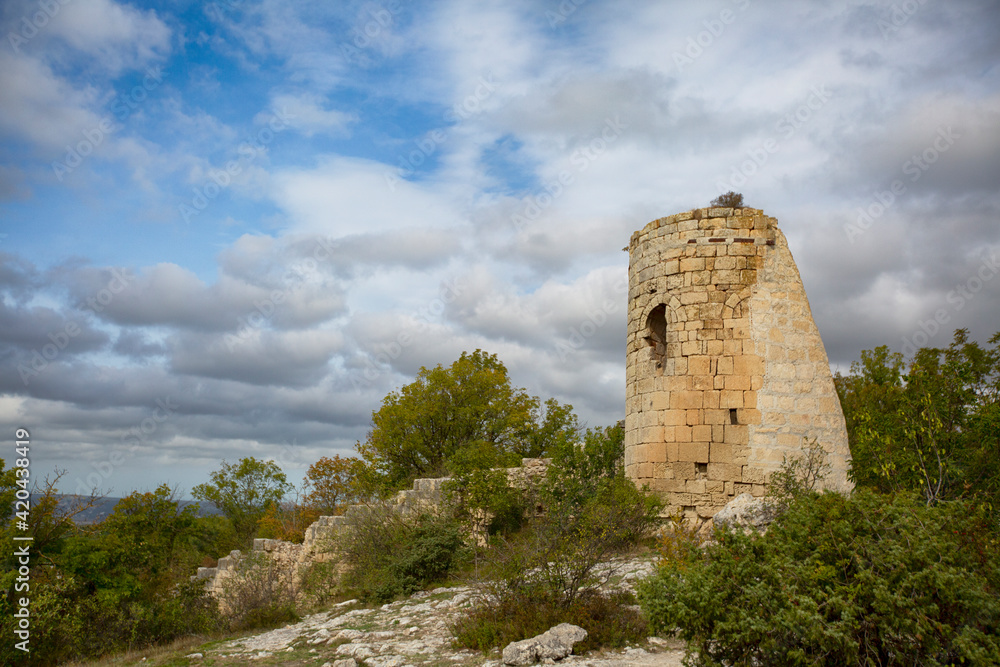 Ruins of the wall and tower of the ancient Syuren fortress high in the mountains in Crimea